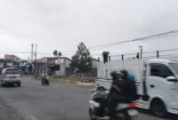 Photo, Nampak Bangunan KDMP Desa Kaliwinasih sudah berdiri kokoh biarpun baru 75% bangunan, berderet dengan Alfa Mart.(Dok.beritafakta.id)